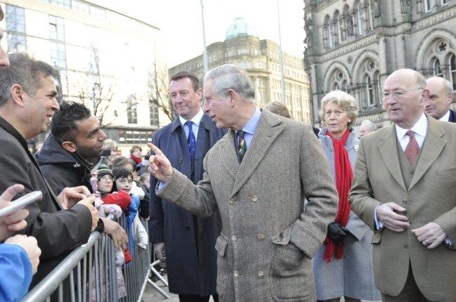 Prince Charles chats to the crowd as he arrives at City Hall in Bradford.