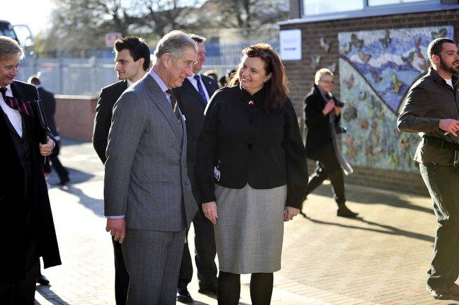 Prince Charles chats with head teacher Mary Copeland on a tour of Belle Vue Girls' School.