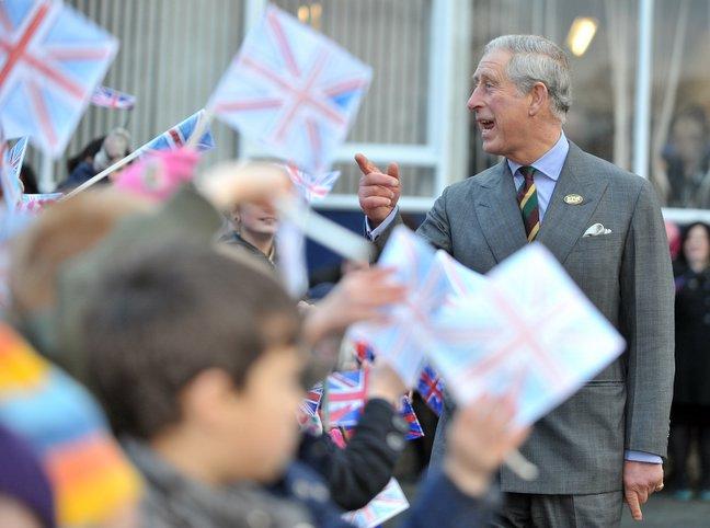 Prince Charles chats to youngsters outside Bulmer and Lumb.
