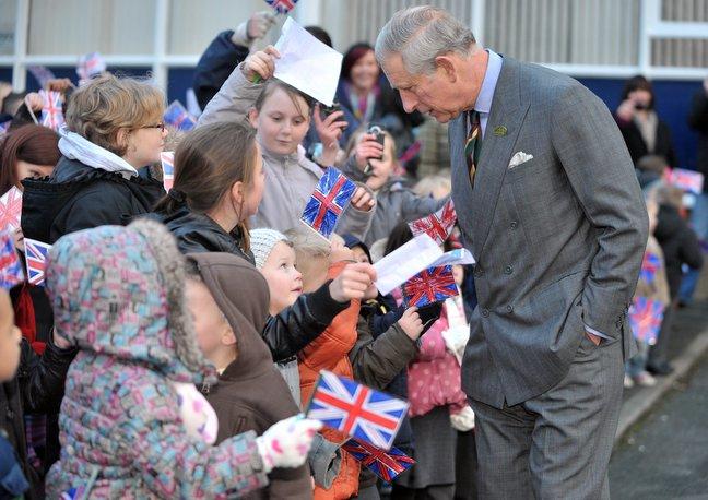 Prince Charles chats to youngsters outside Bulmer and Lumb.
