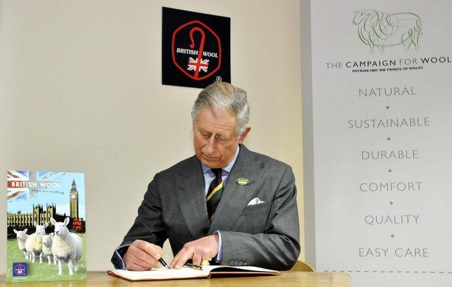 Prince Charles signs the visitors book at the British Wool Marketing Company on the Euroway Trading Estate.