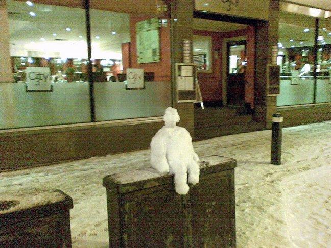 A little snowman sits outside the Hilton Hotel, in Bradford city centre.
