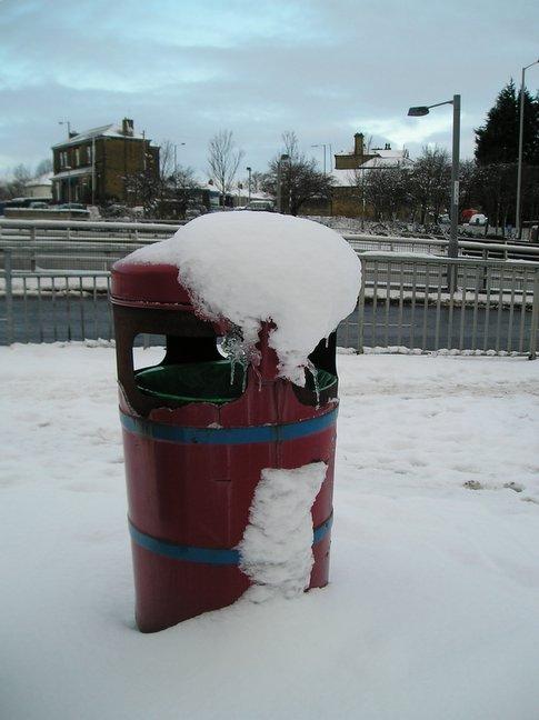 As temperatures drop, snow begins to form ice on this bin at Odsal Top.