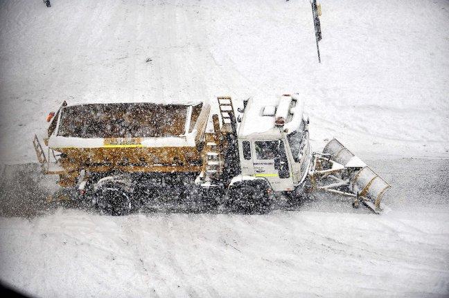 A gritter battles to keep the city centre roads clear.