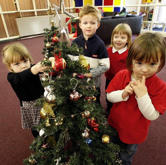 Youngsters from a Keighley nursery decorated Christ-mas trees at the Salvation Army’s High Street headquarters.
The group of four children from Strong Close Nursery was taking part in this year’s Salvation Army Christmas tree appeal. 