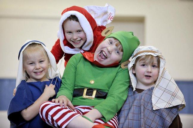 Taking part in Wilsden Primary School Nativity 'A Special Kind of Present' were, from the left, Aidan Wilkins as Joseph, William Dawson as Santa, Jessica Thompson as Elf, and Belle Watkinson as Mary.