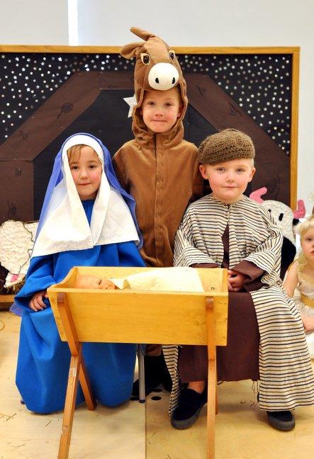 Taking part in Woodside Primary School, Buttershaw, Nativity 'Whoops a Daisy Angel' were, from the left, Maize Robinson, Kieron Brophy and Louie Day.