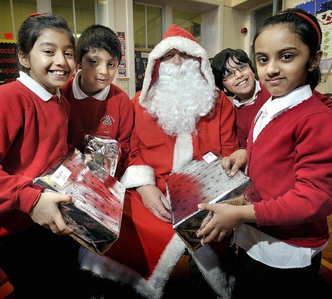 Children at Shipley Church of England Primary School in Otley Road caught an early glimpse of Father Christmas as they broke up for Christmas.
Gifts were handed out during an assembly.