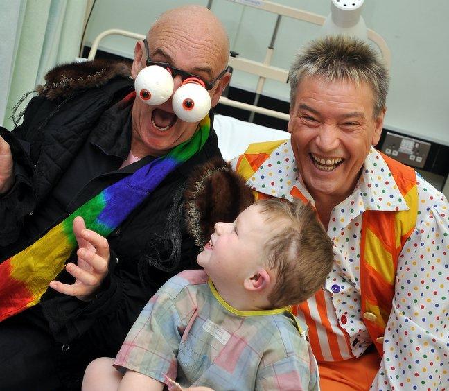 The cast of the Alhambra pantomime Snow White and the Seven Dwarfs brought laughter and smiles to a children’s ward at Bradford Royal Infirmary. 
Peter Piper and Billy Pearce are pictured bringing a smile to the face of patient Kayden Hewitt.