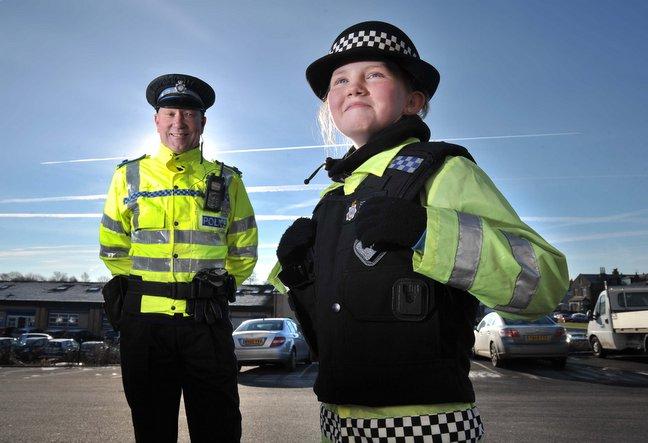 A primary school pupil from Bradford donned a police uniform and went on the beat with an officer. 
The enthusiastic schoolgirl, Chloe McGuire, 11, said she was both “excited” and “proud” to go on patrol with PCSO Denis Bennett. 