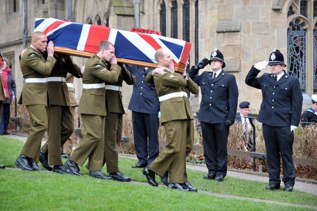 The coffin of Private Martin Bell arrives at Bradford Cathedral, carried by his colleagues