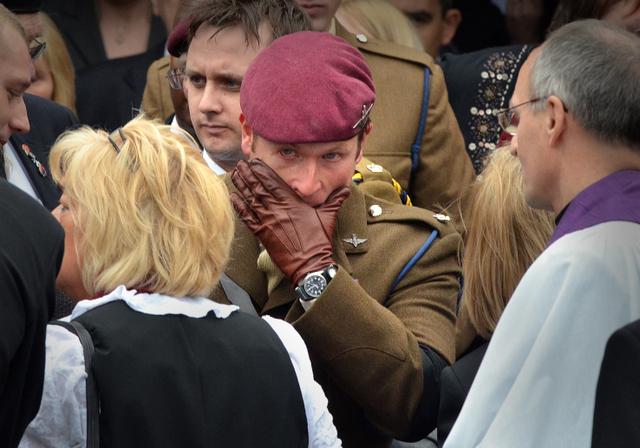 Elaine Bell, the mother of Private Martin Bell, is comforted by a soldier of the Parachute Regiment following the funeral service of her son at Bradford 