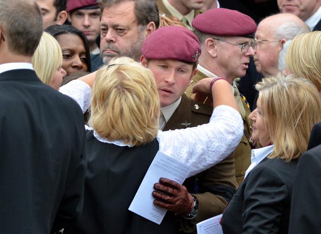 Elaine Bell, the mother of Private Martin Bell, is comforted by a soldier of the Parachute Regiment following the funeral service of her son at Bradford 