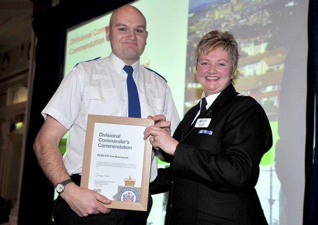 Police Community Support Officer Tom Greenwood, who braved thick, acrid smoke and an exploding vehicle to evacuate residents from a flats complex, recieves his award from Chief Supt Alison Rose..