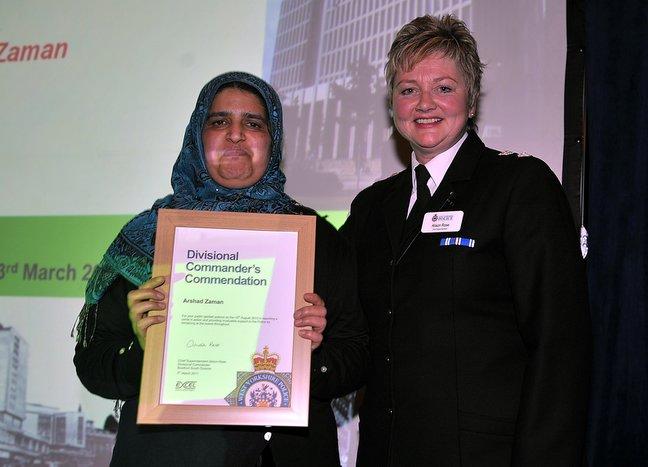 Arshad Zaman, who helped police when she saw two men smashing a car window in Girlington Road and trying to remove the Satnav, receives her award from Chief Supt Alsion Rose.