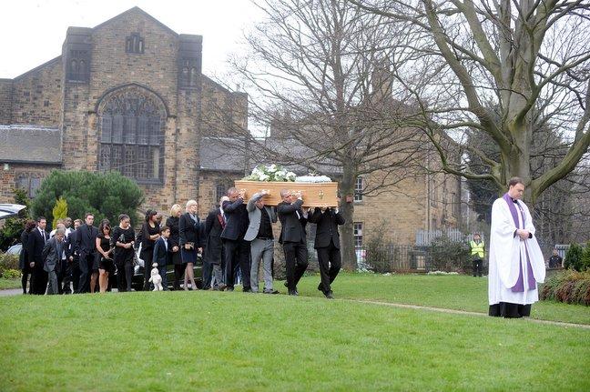 The coffin of Dean Richards arrives at Bradford Cathedral.