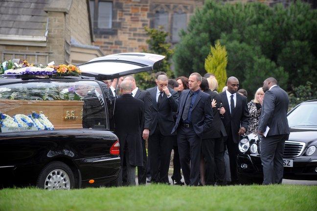 The coffin of Dean Richards arrives at Bradford Cathedral.