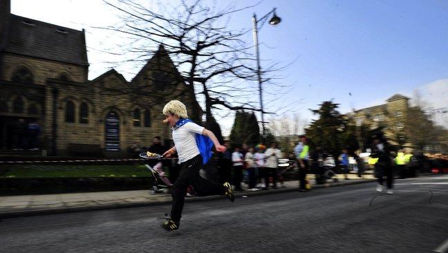 Pupils from various schools from around the IIkley area took part in a Pancake Day Race on The Grove in Ilkley, Pictured are pupils from Ilkley Grammar School.