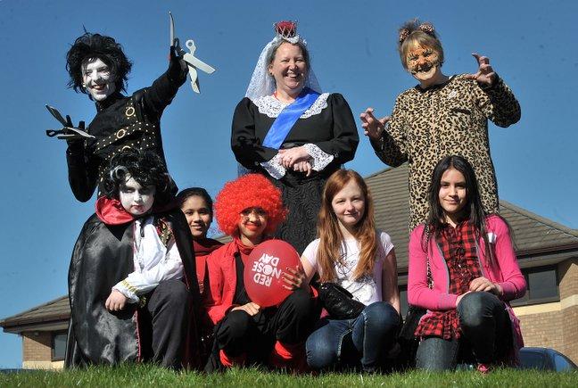 Laisterdyke Business and Enterprise College Red Nose Day. Pictured are Deighton Waterhouse as Edward Scissor Hands, Jan McIntosh as Queen Victoria,  Gaynor Laird with Sam Dempsey as Dracula, Sanjida Begum, Haifsah Iftikhar, Bethany Mcnulty Sofia Ahmed.