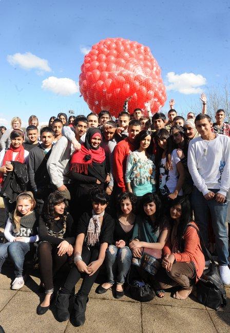 Challenge College students release red ballons for Comic Relief.