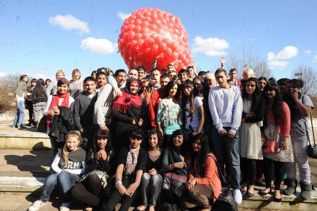 Challenge College students release red ballons for Comic Relief.