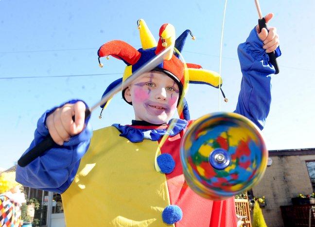 Children from Harden Primary School clowned around at Woodbank Nursery, Harden, to raise money for Comic Relief. Scott Worrall, nine, is pictured having a go with a diabalo.