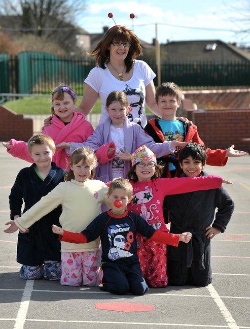 Swain House Primary School pupils came to school in pyjamas for Comic Relief, Pictured are Liam Smith, Chloe Breccini, Benjamin Butt, Daisie Longbottom, head teacher Dianne Rowbotham, Daniel Smith, Freya Thackray, Joe Ellias and Maisie Ellis-Gunnell.