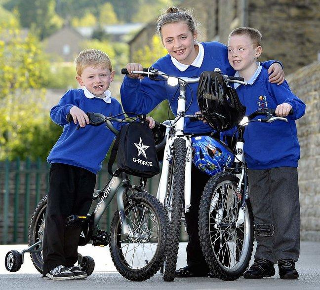 Four children at High Crags Primary in Pratt Lane were presented with bikes from Ellis Briggs Cycles, in Otley Road, Shipley, after being selected at random from a number of pupils who had 100 per cent attendance over seven weeks. 

