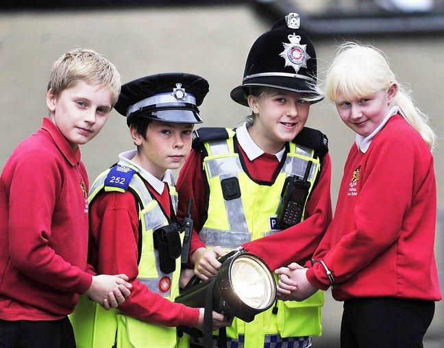 Pupils at Hothfield Junior School, Silsden, had a hands-on look at what their futures might hold at a careers taster day. 
Looking into the police role are (from left) Billy Watson, Matthew Griffiths, Bethany Richardson and Courtney Hancock.
