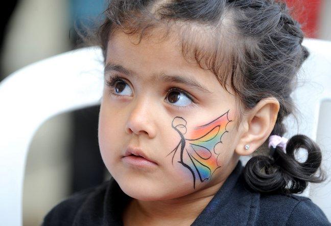 Aqsa Khan, 4, has her face painted.