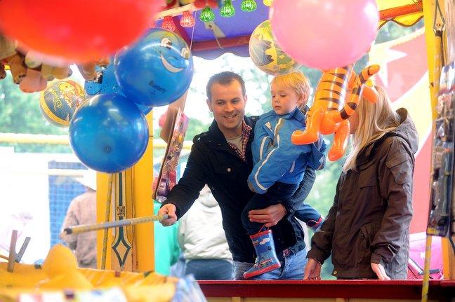 Families flocked to Myrtle Park for fun and games at the annual Bingley Gala yesterday.
Sam and three-year-old William Lunn are pictured playing hook-a-duck.