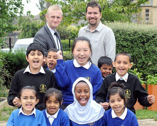 Miriam Lord Community Primary, in Manningham, Bradford, has had its Notice to Improve removed by Ofsted after a positive inspection visit. 
Head teacher Bryan Harrison (back left) and deputy head Steven Young with pupils. 