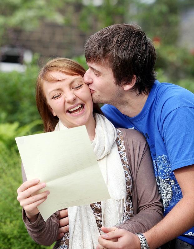 Scott Mashiter kisses his girlfriend Emily Bailey, who got an A and two Bs at South Craven School, Skipton