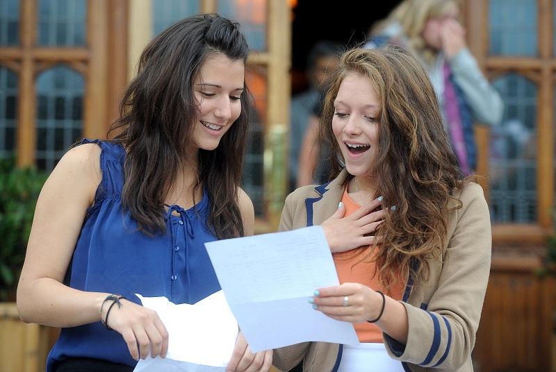 Fabiana Macor and Miriam Brightbart congratulate each other on their results at Bradford Grammar School