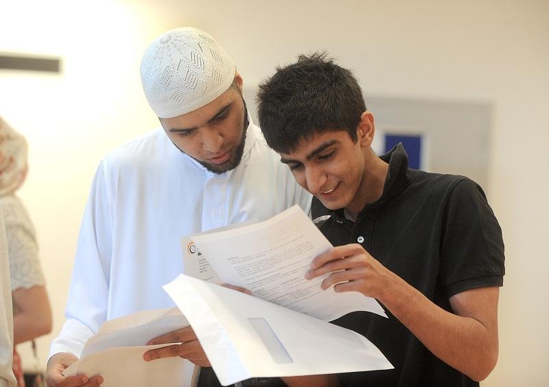 Challenge College pupils
Sufyan Ghias and Mohammed Ashraf look at their results