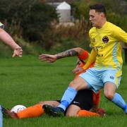 Wrose Bull player Adam Medley (yellow) will hope to shine at home to Shipley Town on Sunday Picture: Richard Leach