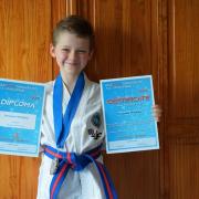 Benjamin Whiteley stands proudly with his certificates after his amazing video effort Picture: Mark Whiteley