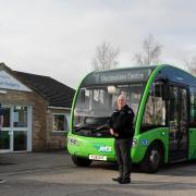 Dr Brendan Kennedy and bus driver Nick Coleman celebrate The Keighley Bus Company doubling the service on its Keighley Jets