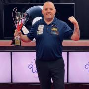 Chris Melling lifts the Champions League Pool trophy on Monday night. Picture: Ultimate Pool.