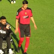 Sohail Abbas with one his players and wearing some Manchester United merchandise, a club where he has some famous connections. Pictures: Silsden AFC.
