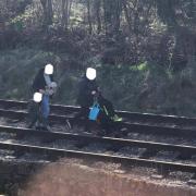 This picture was sent to MP Robbie Moore of two adults and a child walking on the Keighley and Worth Valley Railway line.