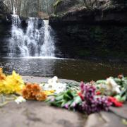 Flowers left at Goit Stock after a boy, named locally as Abu Farhan, 14, died at the waterfall on March 30