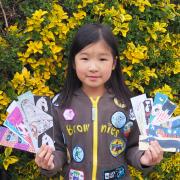 Alyssa, aged eight with some of the bookmarks