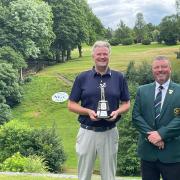 Richard Wheatley (left) lifts the Bradford Open trophy at Northcliffe Golf Club alongside Union president Mark Buckley. Picture: Matthew Stanworth.