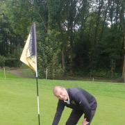 Andrew Busfield stands by his hole in one
