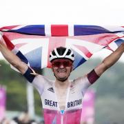 Tom Pidcock celebrates his Olympic gold medal last year. Picture: PA.