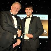 Harley Robertshaw (right) collects the award on behalf of Robertshaw’s Farm Shop at the black-tie dinner last week
