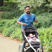 Emon Choudhury (pictured) running with his daughter in a pushchair as he prepares to take on the London Marathon