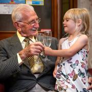 Cheers! Donald, with a glass of fizz, celebrates with great granddaughter Olive, with lemonade