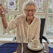 Sally Slaven raises a glass on her 100th birthday
